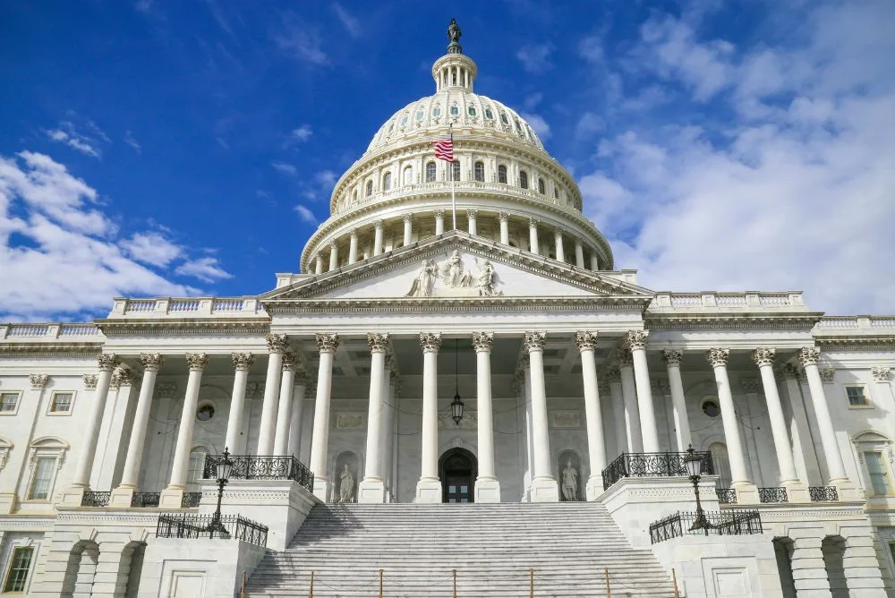 The dome of the United States Capitol in Washington DC against a clear sky