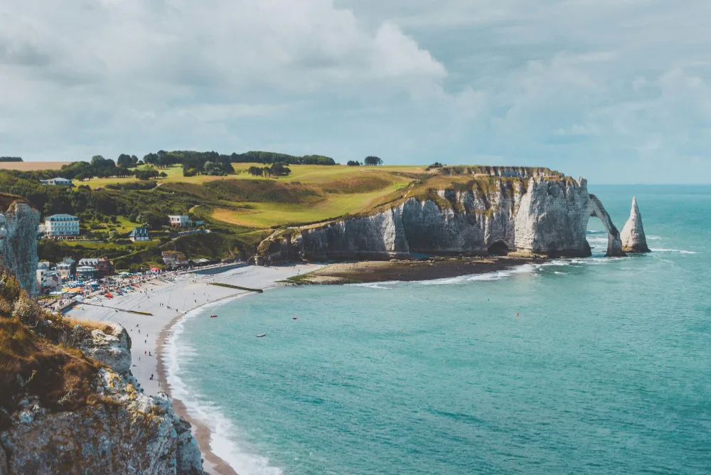 The chalk cliffs and natural arch at Etretat on the Normandy coast