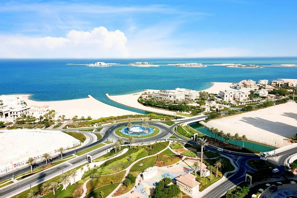 An aerial view of a Qatari coastal resort and its lagoon